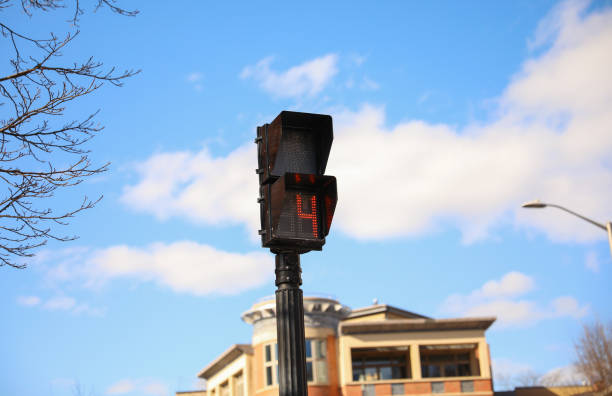 istock street traffic light during rush hour at crosswalk red and yellow at intersection for pedestrian safety depicting a control  warning and caution in urban street with signaling danger 1474749156