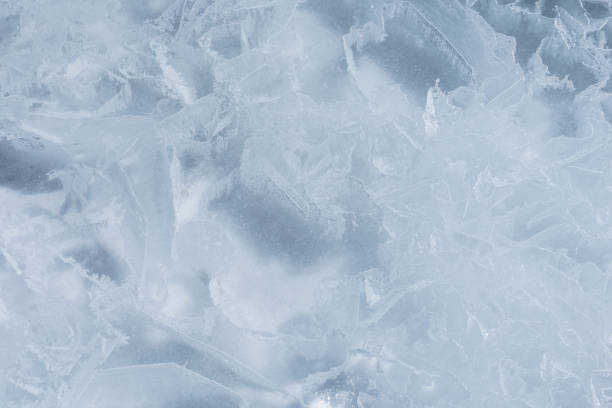 istock Cracked ice on a frozen lake, view from the top. Mouse background. 1474753865