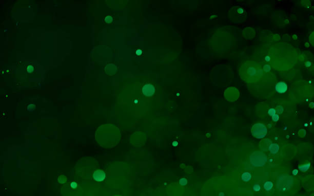 istock Green christmas light glitter bokeh background. 1474754178