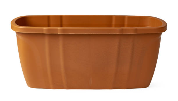 istock Brown plastic flower pot isolated on a white background 1474754855
