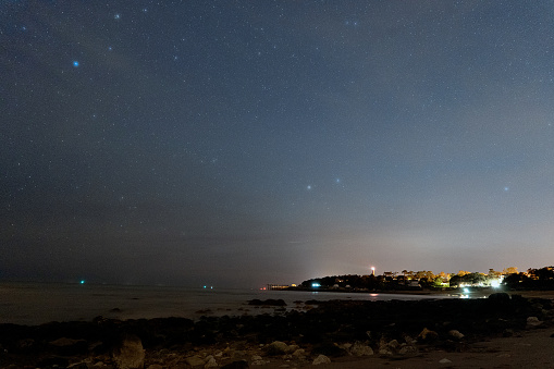 Saint Palais sur Mer on a summer evening, under the stars in front of the lighthouse and squares.