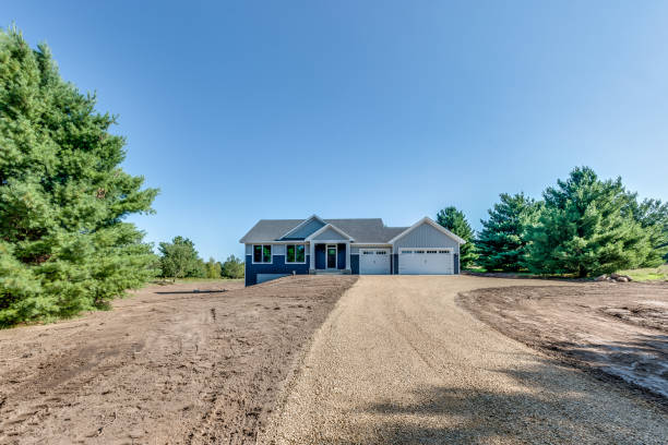 istock Road leading to home on a gorgeous day 1474757148