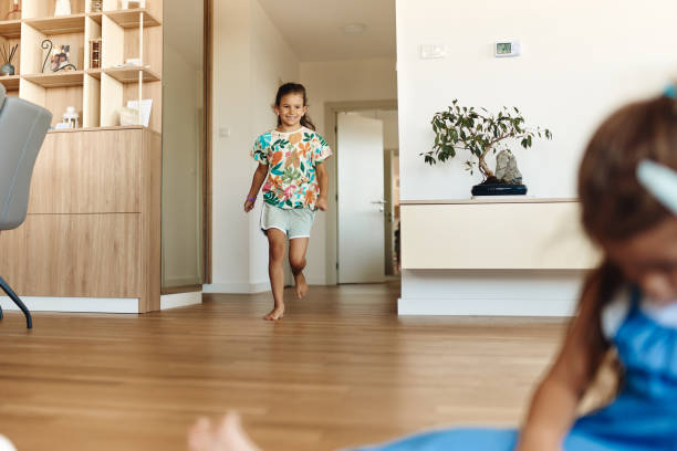 istock Beautiful children playing in the apartment 1474757329