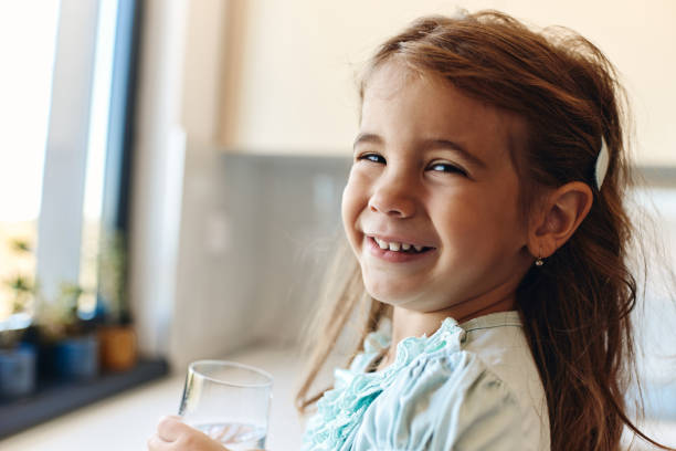 istock Beautiful girl drinking water 1474757350