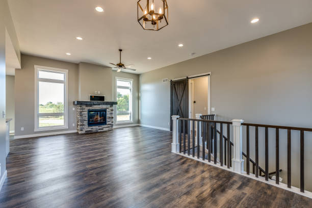 istock Open great room with stairs leading to the basement 1474757420