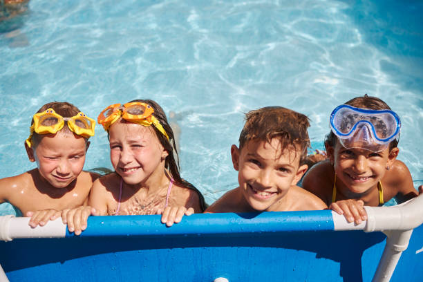istock Children games in swimming pool 1474757428