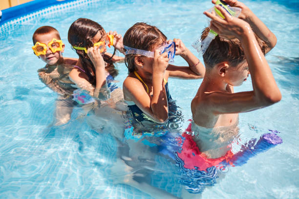 istock Children games in swimming pool 1474757443