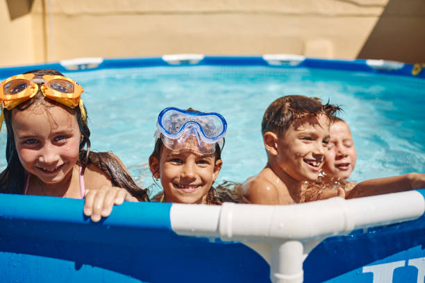 istock Children games in swimming pool 1474757469