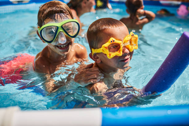 istock Children games in swimming pool 1474757498