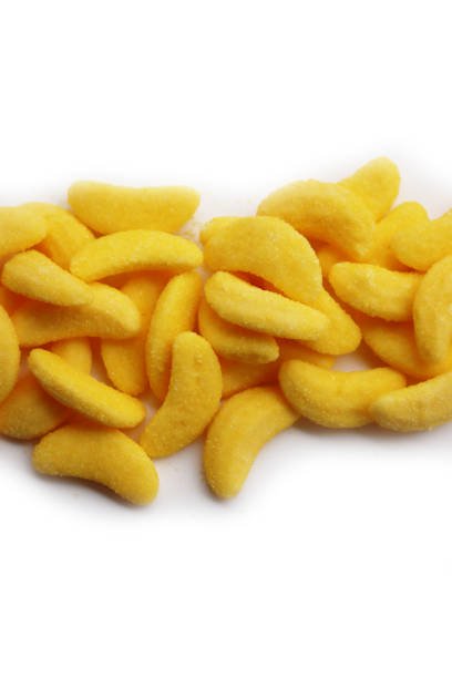 istock Yellow jelly banana sweets on white background 1474759265