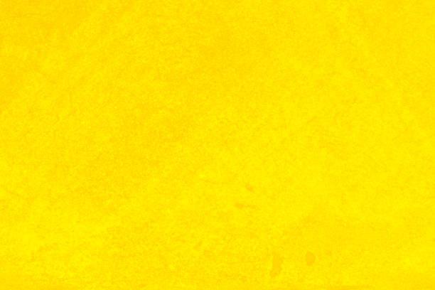 istock Yellow concrete or cement material in abstract wall background texture. 1474759615
