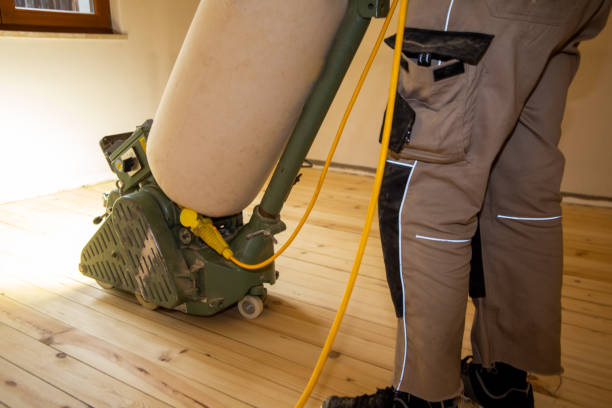istock Craftsman professionally sanding a plank floor 1474761926