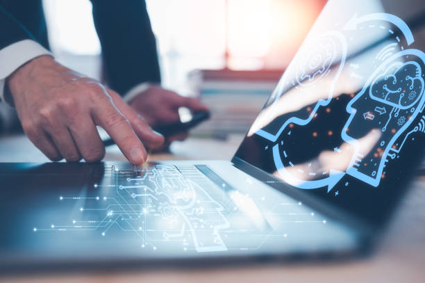 istock AI technology concept, man using AI tech to working business project, businessman working on computer laptop and books to analyst and develop business growth 1474763984