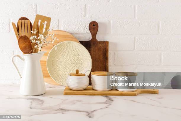 https://media.istockphoto.com/id/1474769775/photo/a-set-of-modern-kitchen-utensils-in-a-minimalist-style-on-a-white-marble-countertop-against-a.jpg?s=612x612&w=is&k=20&c=ikKdIgaVdHwkibQGUF3qqvX7KS49WliMseJlnPmiing=
