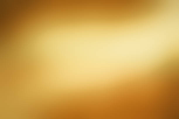 istock Light shining down on gold foil metal with copy space, abstract background. 1474770716