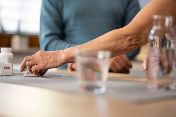 istock Woman's hand holding medicine box 1474770964