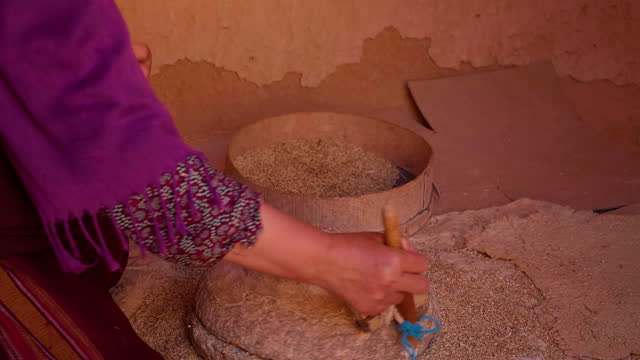 Stone Hand Flour Mill Woman Making Wheat Flour Close up.