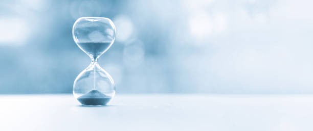 istock Hourglass with blurred background and copy space 1474778210