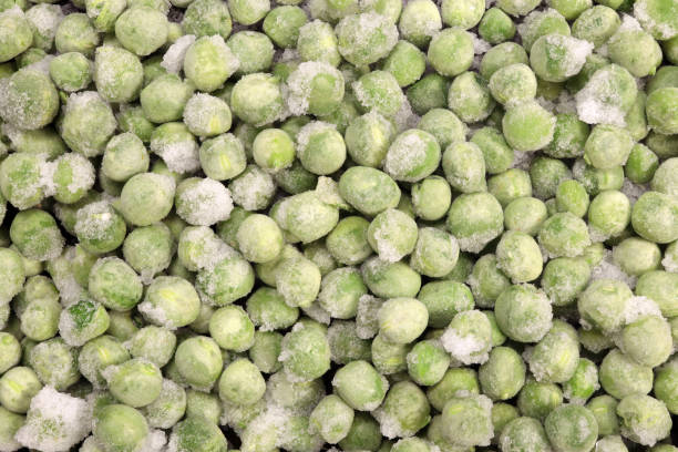 istock Background, texture of frozen green peas 1474778422