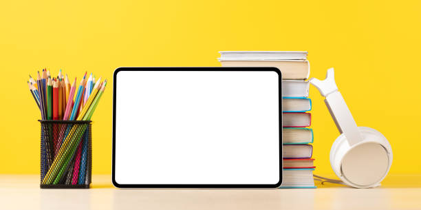 istock Tablet with colorful pencils and stack of books 1474778456