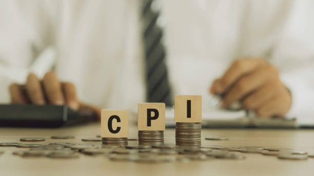 istock Businessman checking CPI. Smart businessman using calculator for modern expenses. The concept of the consumer price index symbol. 1474778469