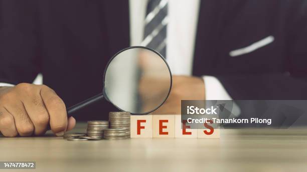 Businessman Checking Fees Concept Fee Fee Service And Tax Stock Photo - Download Image Now