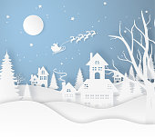istock santa claus fly on the city and earth with snow, ice, trees and home in the winter season. christmas, paper art. 1474778803