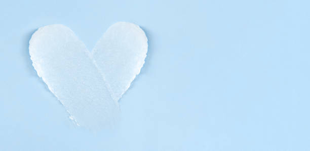 istock cosmetic smears scrub cream texture on pastel blue background 1474778889
