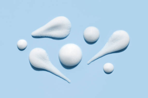 istock texture foam mousse foam cosmetic smear sample on blue background 1474779141