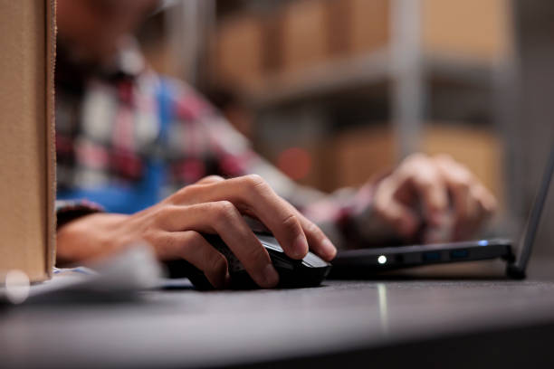 istock Postal warehouse employee checking delivery customer satisfaction on laptop 1474780390
