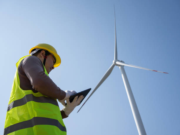 istock Electrician inspecting wind power station 1474780502