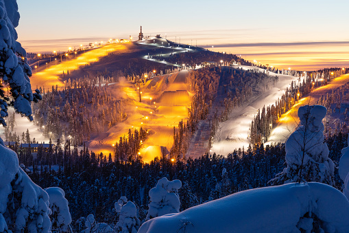 A high angle view to Ruka ski resort slopes on a late winter evening near Kuusamo, Northern Finland