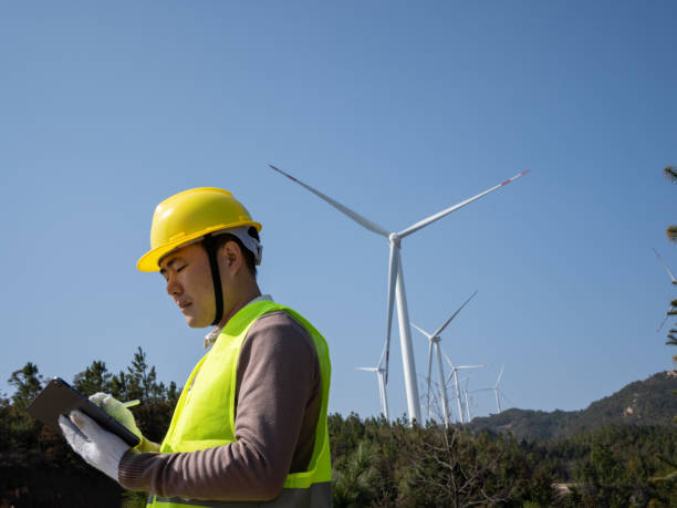 istock Electricity workers are inspecting wind turbines 1474780617