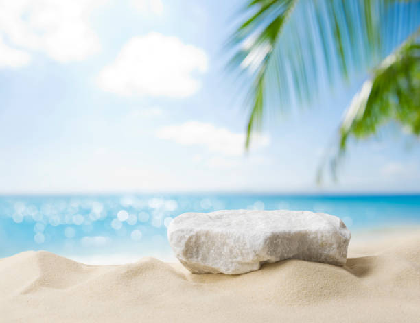 Summer sand and tropical sea background with abstract stone podium stock photo