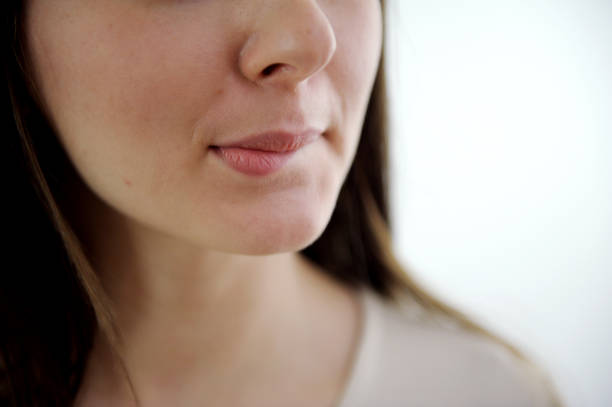 istock Young woman against white background 1474782202