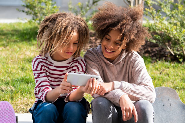 istock Children with smart phone 1474782203