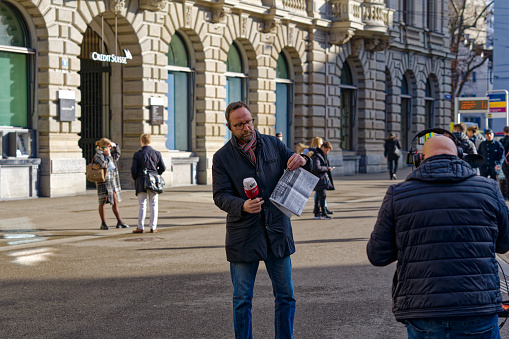 Entrance of headquarters of Credit Suisse bank with Sky and tg24 media reporter at day after rescue deal on a sunny later winter morning. Photo taken March 20th, 2023, Zurich, Switzerland.