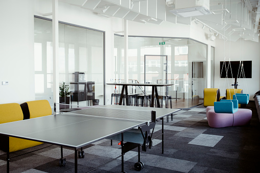 Interior photography of a contemporary design corporate office break out area with a ping pong table and lounge