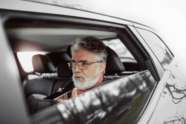 istock Business in the back seat 1474787659