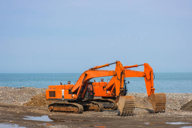 istock Excavators or diggers on construction site or earthmoving at shore protection works in Batumi 1474787706