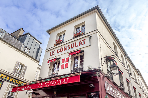 Paris, France - 6 March, 2023: View of the Consulat in Montmartre.  The traditional district is famous by its cafes, restaurants and nightlife.