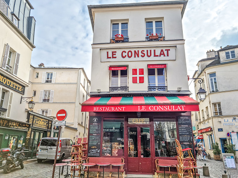 Paris, France - 6 March, 2023: View of the Consulat in Montmartre.  The traditional district is famous by its cafes, restaurants and nightlife.
