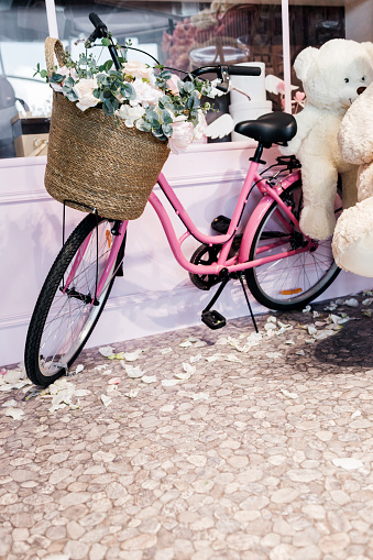 Stylish bicycle with wicker basket and flowers. Vintage Bicycle