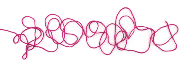 istock Tangled colorful cotton thread isolated on white background. 1474796136