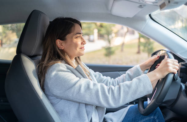 istock Smiling Woman In Car 1474797506