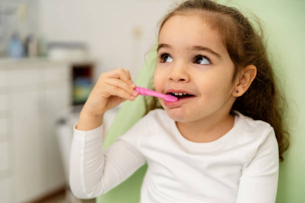 istock Little Girl Is Learning How To Proper Brush Her Teeth 1474798001