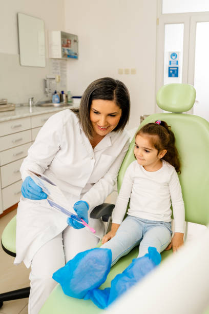 istock Little Girl's First Visit At The Dentist Office 1474798794