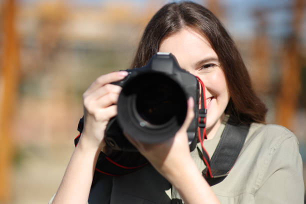 istock Happy photographer taking photos with camera 1474799232