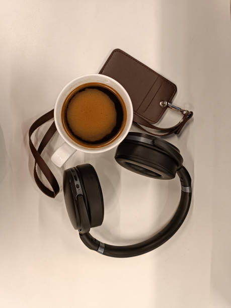 Macbook Pro, a cup of coffee, headphone