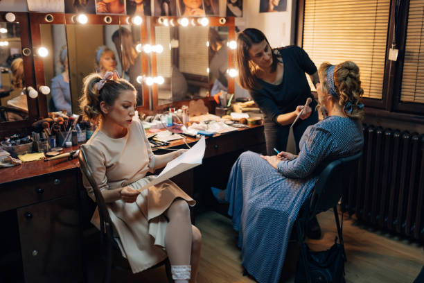 istock An actress in costume sits ready next to a senior actress preparing for a performance 1474801194
